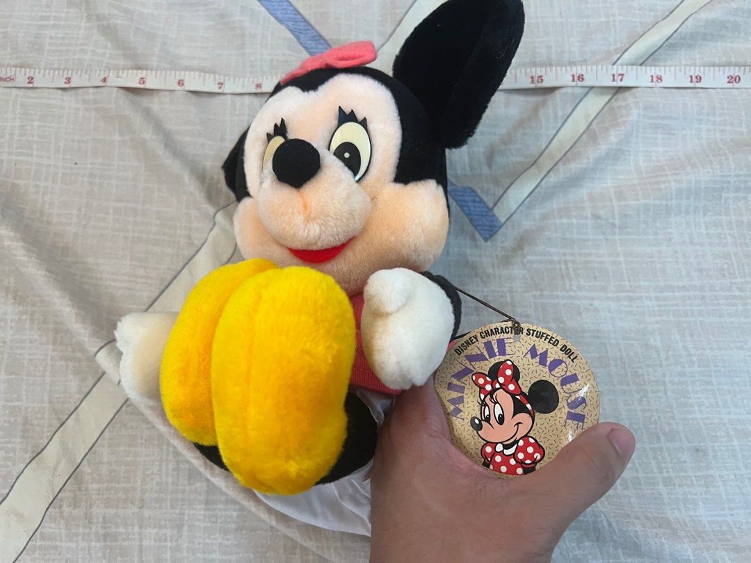 Official Disney Minnie Mouse Stuffed Doll (Category: Plushies & Soft Toys) located in Rizal. Submitted by leanchester24 (Listing ID 1411809935, Image 2). Description: Adorable Minnie Mouse stuffed doll. Features a pink bow, dress, and yellow shoes. Includes original tags. Made by Sun Arrow. A perfect addition to any Disney collection or a great gift for a Minnie Mouse fan..