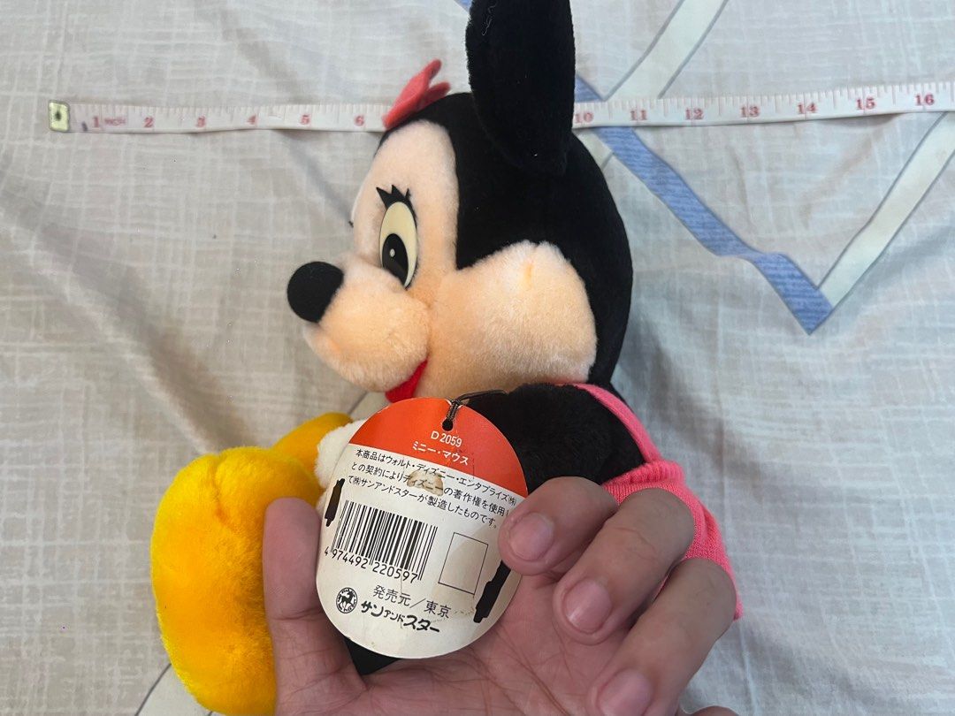 Official Disney Minnie Mouse Stuffed Doll (Category: Plushies & Soft Toys) located in Rizal. Submitted by leanchester24 (Listing ID 1411809935, Image 3). Description: Adorable Minnie Mouse stuffed doll. Features a pink bow, dress, and yellow shoes. Includes original tags. Made by Sun Arrow. A perfect addition to any Disney collection or a great gift for a Minnie Mouse fan..