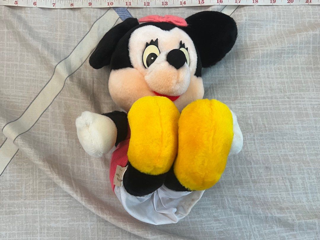 Official Disney Minnie Mouse Stuffed Doll (Category: Plushies & Soft Toys) located in Rizal. Submitted by leanchester24 (Listing ID 1411809935, Image 1). Description: Adorable Minnie Mouse stuffed doll. Features a pink bow, dress, and yellow shoes. Includes original tags. Made by Sun Arrow. A perfect addition to any Disney collection or a great gift for a Minnie Mouse fan..