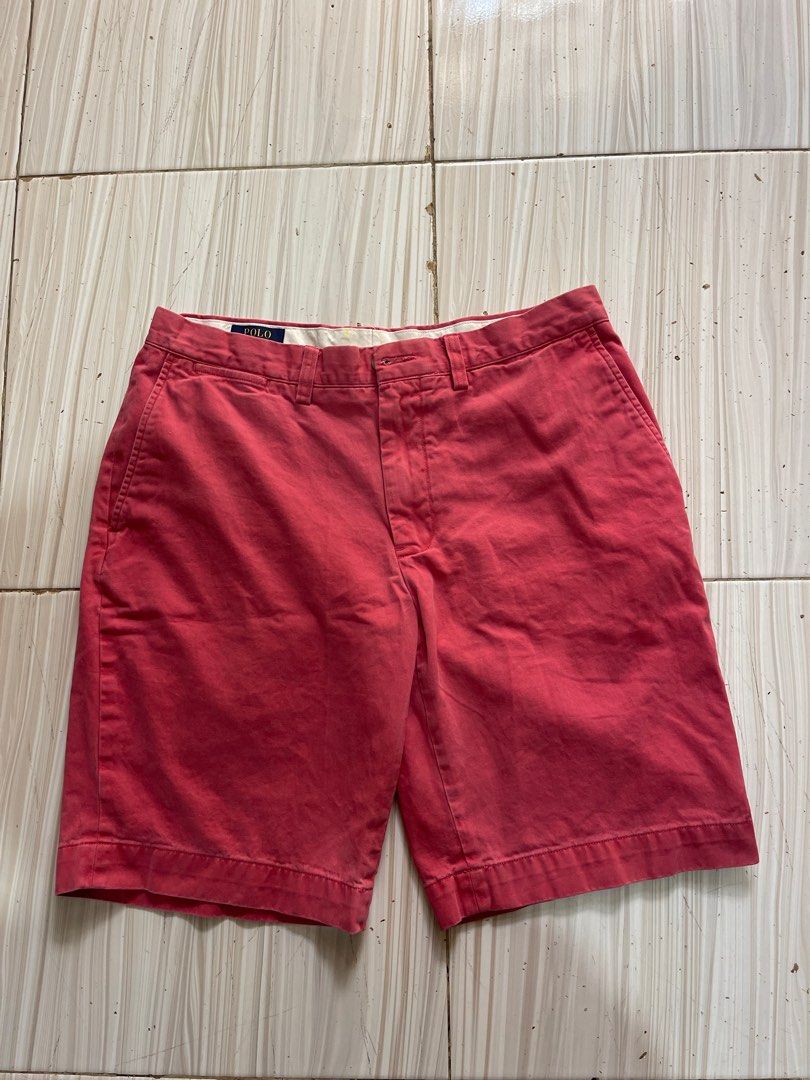Polo Ralph Lauren Shorts (Category: Shorts) located in Cebu City. Submitted by retsiiiii (Listing ID 1411789618, Image 1). Description: - Polo Ralph Lauren shorts - Reddish-pink color - Button and zipper closure - Front and back pockets - Polo Ralph Lauren label visible - Perfect for casual wear.