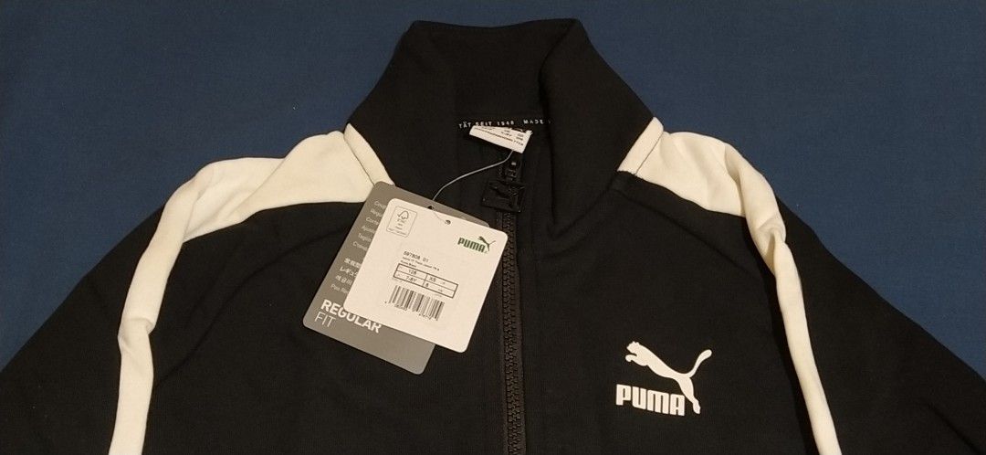 Puma Track Jacket Black and White (Category: Coats, Jackets and Outerwear) located in Ligao. Submitted by travis40 (Listing ID 1411917406, Image 2). Description: Deadstock never worn rfs wrong size - Puma track jacket - Classic black and white design - Full zip closure - Stand-up collar - Puma logo on chest - White stripes on sleeves - Extra small - With tag attached.