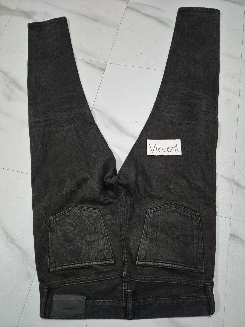RRL Double RL Denim Jeans 30x30 (Category: Jeans) located in Bulacan. Submitted by vince4593 (Listing ID 1411843355, Image 2). Description: RRL Double RL denim jeans in black. Features a zip fly and slim narrow fit. Made in Mexico. Size is 30x30. The jeans have a leather patch on the back. The zipper has "DOUBLE RL" and "RIVETED" engraved on it. The inner tag shows the supplier and material information..