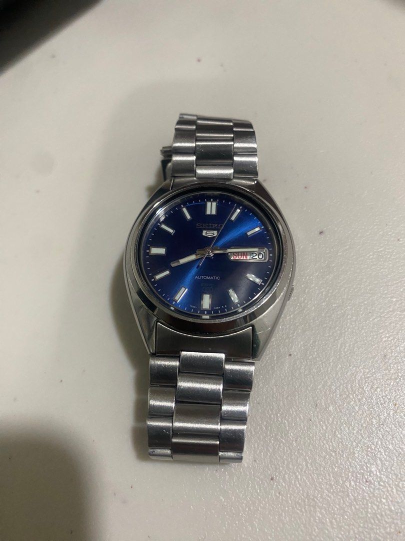 Seiko 5 Automatic Sunburst Blue Dial (Category: Men's Watches) located in Santa Rosa. Submitted by maranangiancarlo (Listing ID 1411843044, Image 1). Description: - Seiko 5 automatic watch - Sunburst blue dial - Slight scratches (not noticeable) - Model 7S26 3040 - Automatic movement FOR MEETUPS AND/OR DELIVERY.