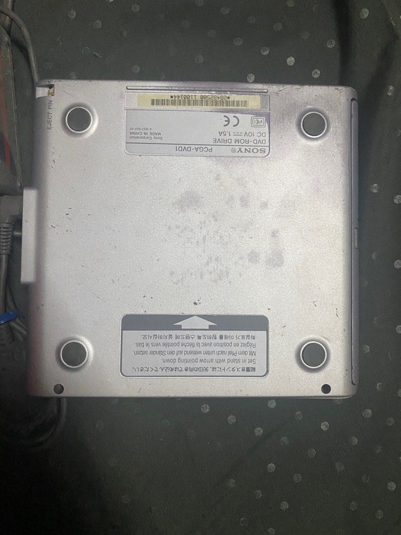 Sony VAIO PCGA-DVD1 DVD-ROM Drive (Category: Laptops & Notebooks) located in Manila. Submitted by olxph_540542159 (Listing ID 1411794097, Image 3). Description: - Sony VAIO PCGA-DVD1 DVD-ROM Drive - Includes the drive and power adapter - Features a stylish silver finish - VAIO logo is prominently displayed - Portable DVD-ROM drive.