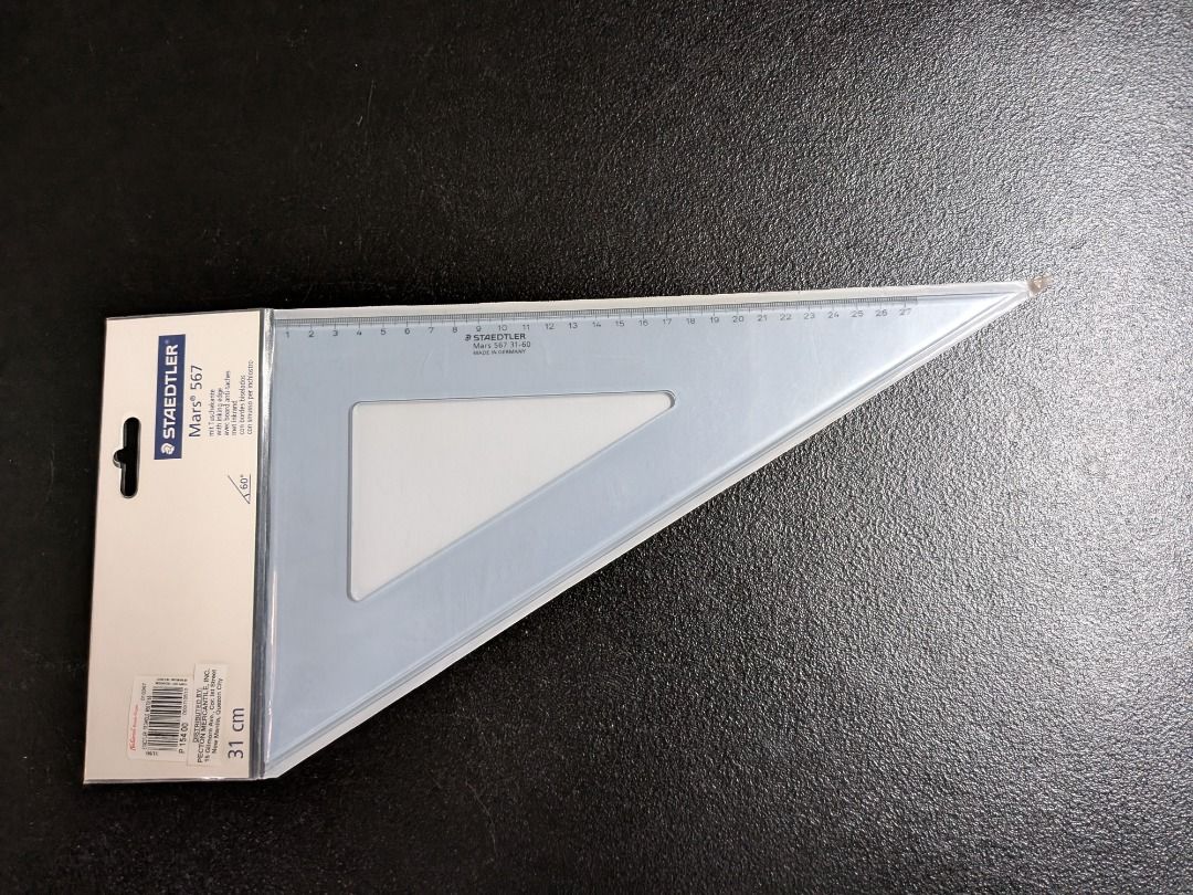 Staedtler Mars 567 Triangle Ruler 31cm 60 degrees (Category: Stationery & School Supplies) located in Quezon City. Submitted by geloboy10 (Listing ID 1411923438, Image 1). Description: product sold as is Staedtler Mars 567 triangle ruler is 31cm long. It is still in its original packaging. The price tag shows it was originally sold for 154 pesos. The ruler is distributed by Pector Mercantile, Inc. in Quezon City. It is a clear, transparent ruler 