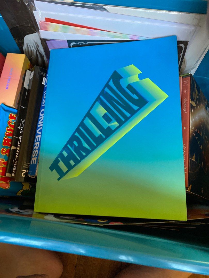 The Boyz Thrill-ing Album (Category: CDs & DVDs) located in Pasig City. Submitted by alaineeeee (Listing ID 1411857177, Image 1). Description: - ATEEZ 'Thrilling' album - Features a blue and yellow gradient cover - 'THRILLING' in bold letters on the cover - Other albums visible in the background.