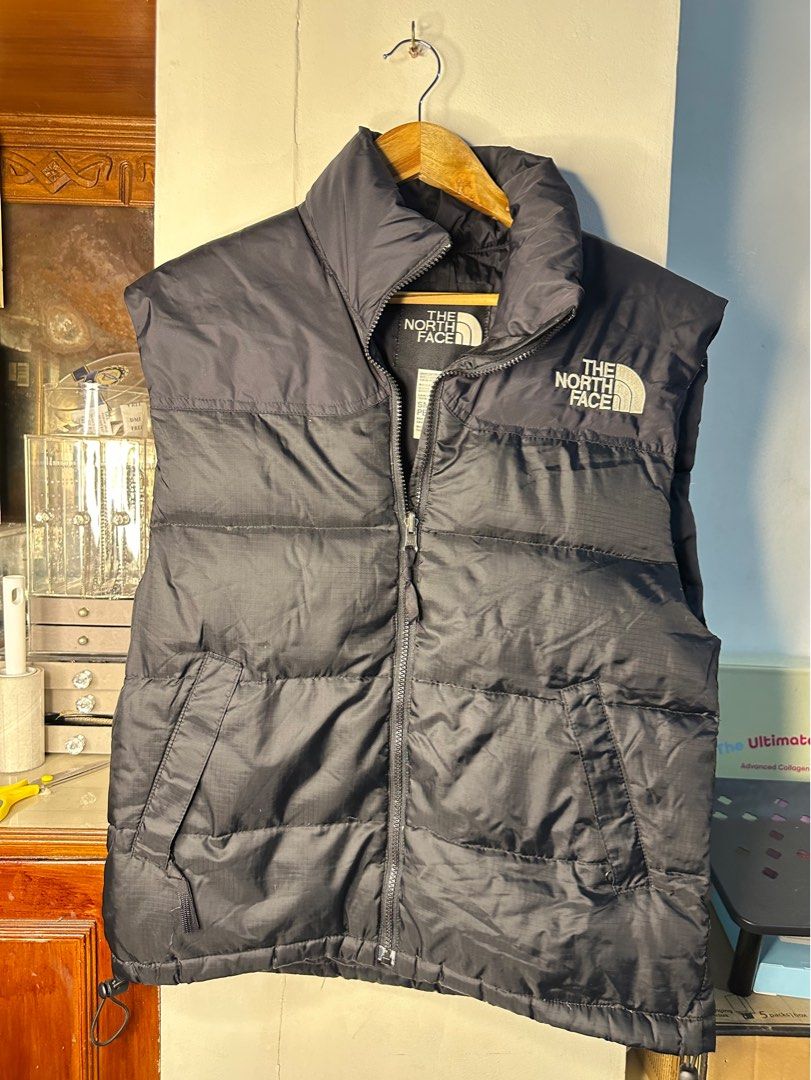 The North Face Puffer Vest - Goose Down (Category: Vests) located in Makati City. Submitted by rosie.cpa (Listing ID 1411801538, Image 1). Description: - Authentic - Black The North Face puffer jacket/ vest -Goose down insulation - Full zip closure - 22x26 - The North Face logo on chest - High collar for warmth - Great for layering - Perfect for autumn and winter.