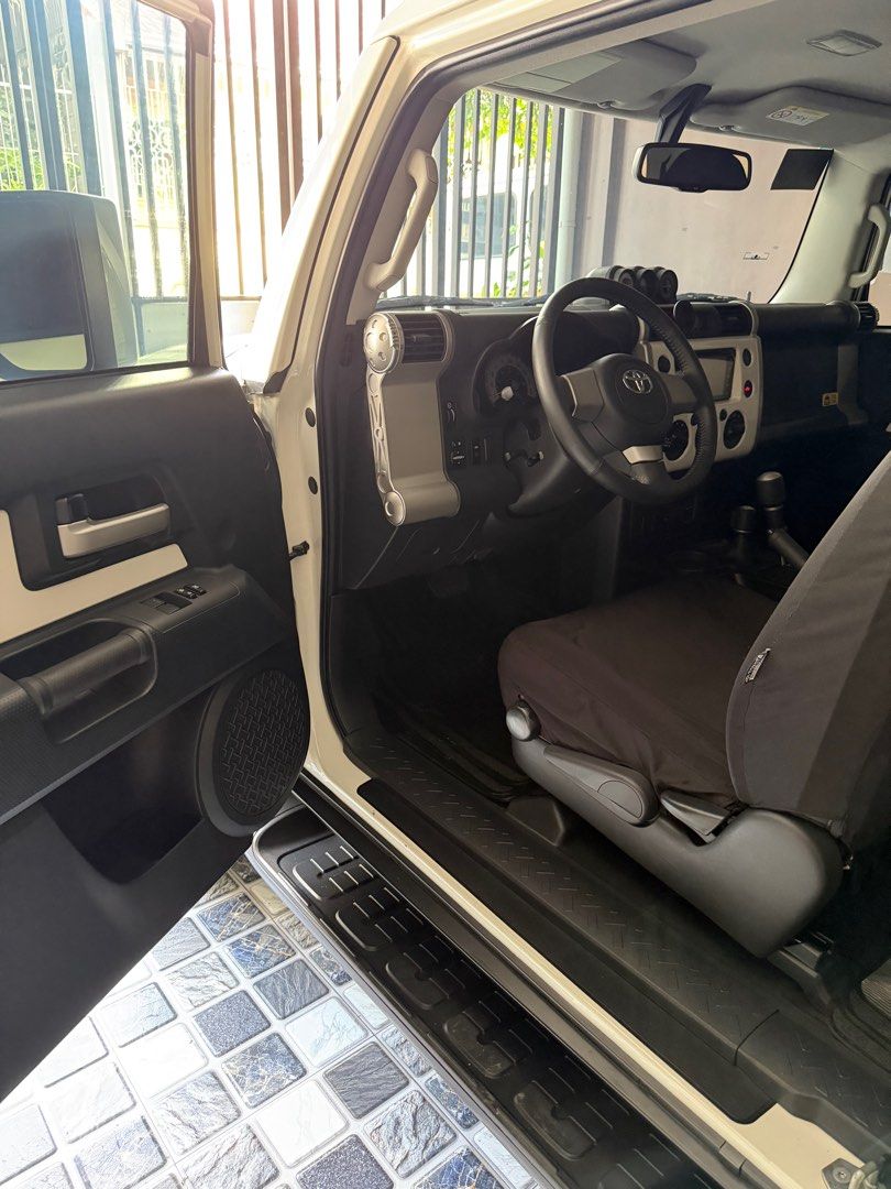 Toyota FJ Cruiser (Category: Used Cars) located in Quezon City. Submitted by deedee12920 (Listing ID 1411886351, Image 3). Description: 2018 Toyota FJ Cruiser 4x4 Automatic 7tkms mileage Casa Maintained Ending 7 Black Rhino 20 inch w/ Terra Grappler Tires Toyota TRD Skid Plate Toyota Fog Lights Fabric Seat Cover FJ Trail Teams Badge (Interior and Exterior) RFID installed Price is slightly negotiable upon viewing.
