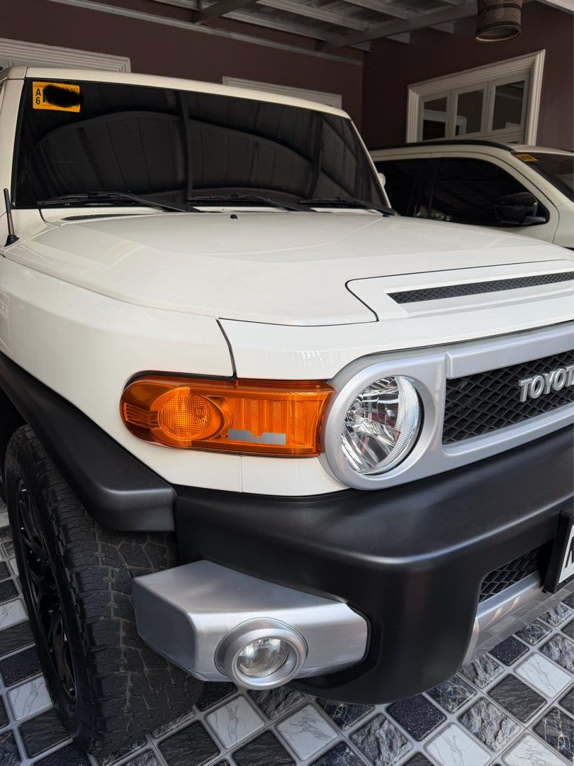 Toyota FJ Cruiser (Category: Used Cars) located in Quezon City. Submitted by deedee12920 (Listing ID 1411886351, Image 2). Description: 2018 Toyota FJ Cruiser 4x4 Automatic 7tkms mileage Casa Maintained Ending 7 Black Rhino 20 inch w/ Terra Grappler Tires Toyota TRD Skid Plate Toyota Fog Lights Fabric Seat Cover FJ Trail Teams Badge (Interior and Exterior) RFID installed Price is slightly negotiable upon viewing.