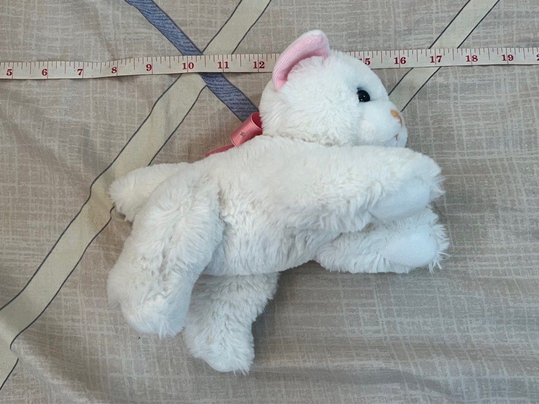 White Cat Plush Toy with Pink Bow Blue Magic (Category: Plushies & Soft Toys) located in Rizal. Submitted by leanchester24 (Listing ID 1411809934, Image 1). Description: - Adorable white cat plush toy - Features pink inner ears and a small pink bow - Bright blue eyes - Soft, fluffy texture - Perfect for kids or collectors.