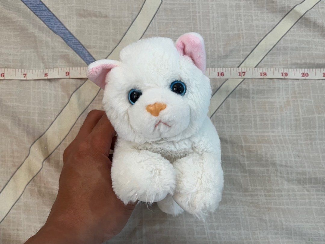 White Cat Plush Toy with Pink Bow Blue Magic (Category: Plushies & Soft Toys) located in Rizal. Submitted by leanchester24 (Listing ID 1411809934, Image 2). Description: - Adorable white cat plush toy - Features pink inner ears and a small pink bow - Bright blue eyes - Soft, fluffy texture - Perfect for kids or collectors.