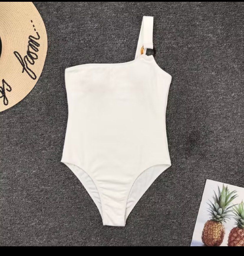 White One-Shoulder Swimsuit (Category: Bikinis & Swimsuits) located in Imus. Submitted by declutterwithria (Listing ID 1411876667, Image 2). Description: - White one-shoulder swimsuit - Unique ring detail on strap - Textured fabric - Flattering cut - Stylish and comfortable - Ideal for beach or poolside READ BEFORE INQUIRING! -Most items are preloved unless stated otherwise. -First to pay gets the item‼️ -Shipping day is every Friday only‼️ 📌 ST