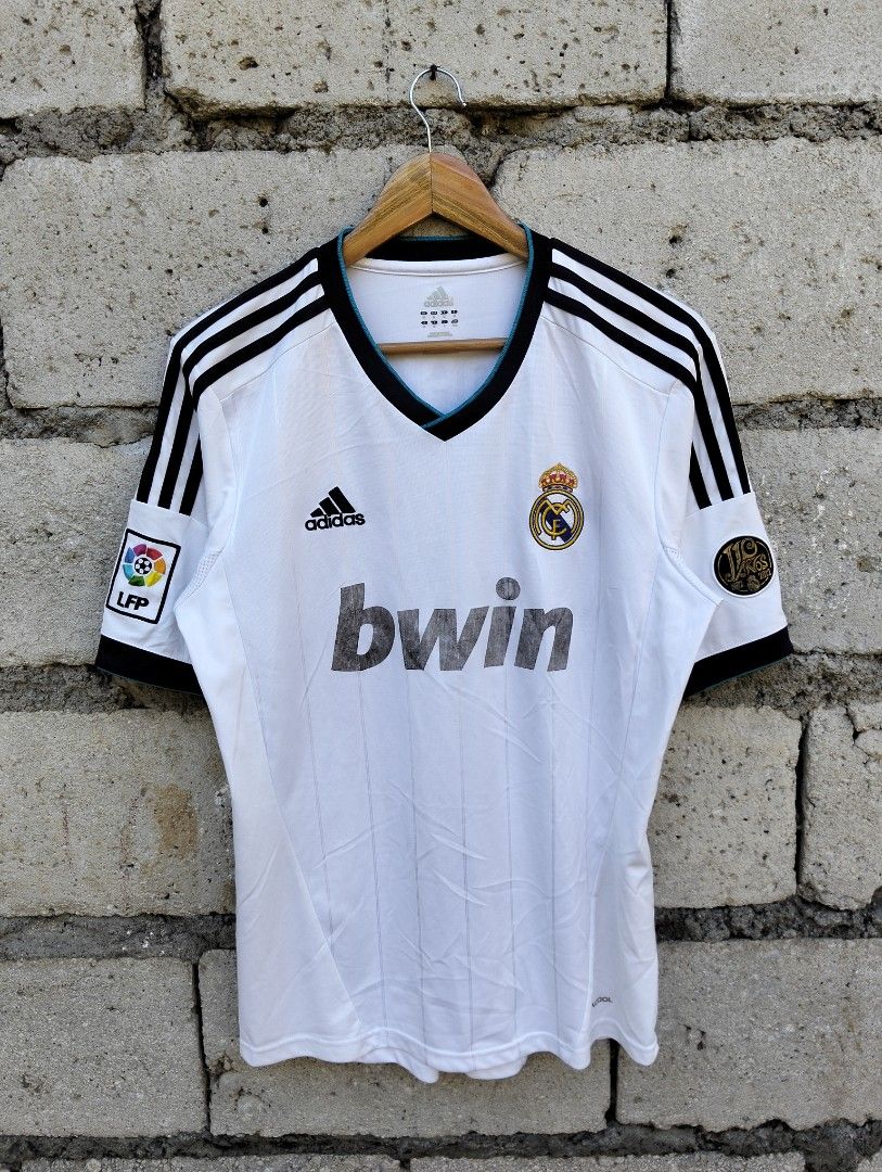 Adidas Real Madrid Ronaldo Jersey (Category: Activewear) located in Dagupan City. Submitted by youngthrift_ (Listing ID 1411969461, Image 3). Description: - Authentic Real Madrid jersey - Features Ronaldo's name and number 7 - Adidas logo and bwin sponsor - Black accents on sleeves and collar - Includes LFP patch - Made in Vietnam Size: M on tag width: 20.5 length: 29.5 Shoulder: 19 Sleeve: 11.5 Issue: see the pict (Colors may vary due to lightin