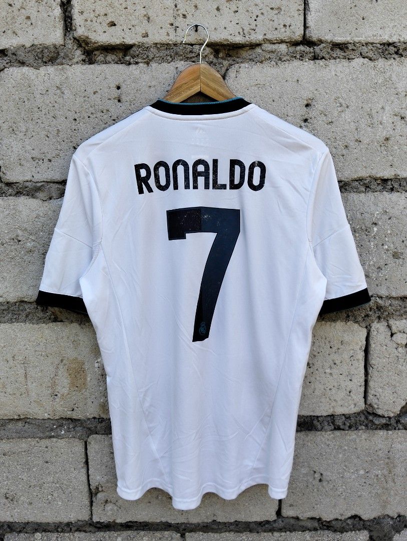 Adidas Real Madrid Ronaldo Jersey (Category: Activewear) located in Dagupan City. Submitted by youngthrift_ (Listing ID 1411969461, Image 1). Description: - Authentic Real Madrid jersey - Features Ronaldo's name and number 7 - Adidas logo and bwin sponsor - Black accents on sleeves and collar - Includes LFP patch - Made in Vietnam Size: M on tag width: 20.5 length: 29.5 Shoulder: 19 Sleeve: 11.5 Issue: see the pict (Colors may vary due to lightin