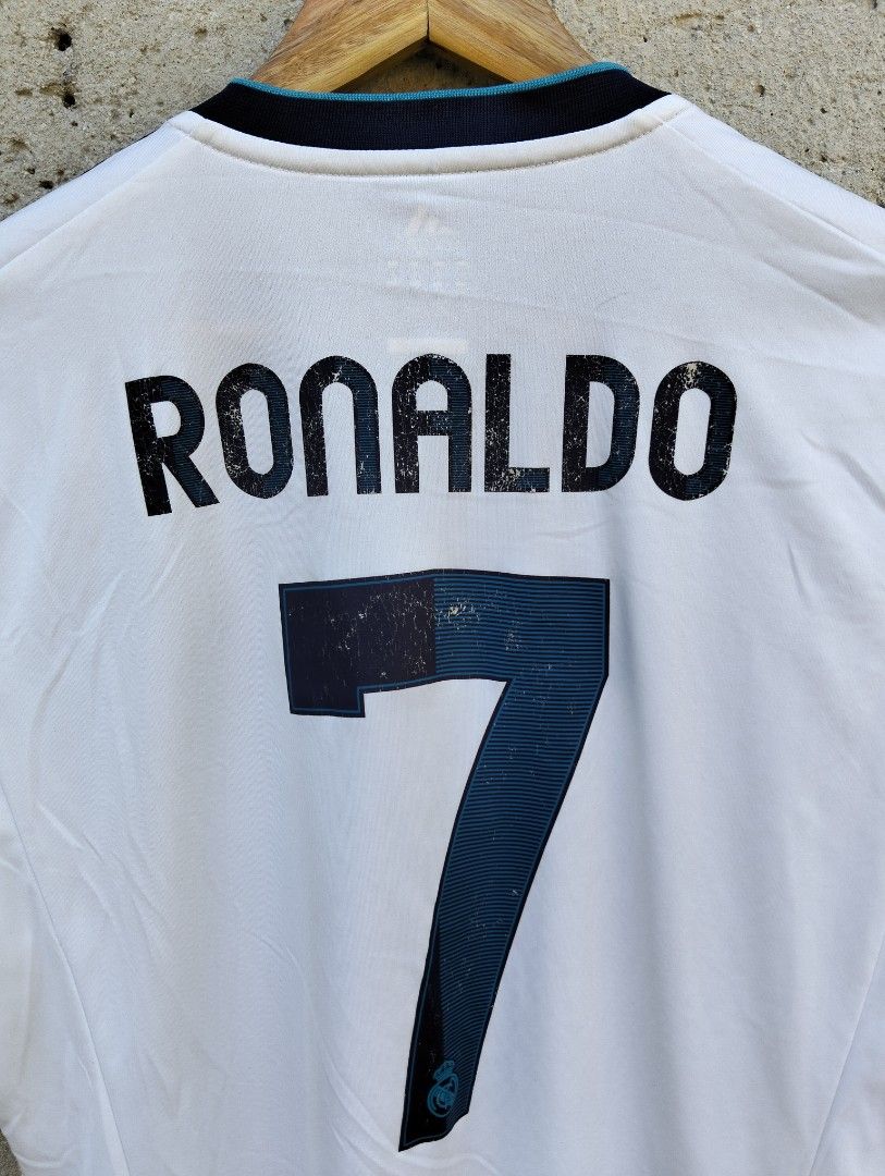 Adidas Real Madrid Ronaldo Jersey (Category: Activewear) located in Dagupan City. Submitted by youngthrift_ (Listing ID 1411969461, Image 2). Description: - Authentic Real Madrid jersey - Features Ronaldo's name and number 7 - Adidas logo and bwin sponsor - Black accents on sleeves and collar - Includes LFP patch - Made in Vietnam Size: M on tag width: 20.5 length: 29.5 Shoulder: 19 Sleeve: 11.5 Issue: see the pict (Colors may vary due to lightin