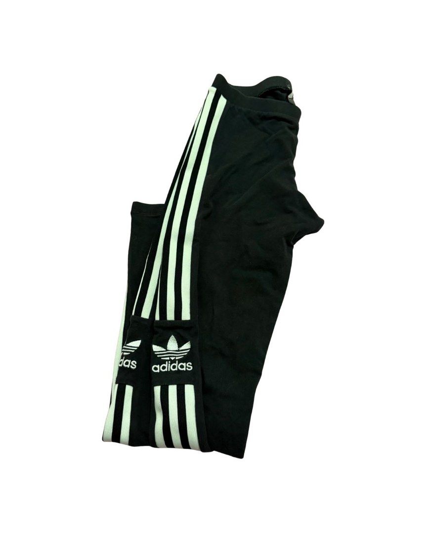 Adidas Trefoil Leggings (Category: Activewear) located in Malabon City. Submitted by decluttergyal (Listing ID 1412126452, Image 1). Description: - Adidas leggings - Black with white stripes - Adidas logo detail - Stretchy material - Classic three-stripe design - Mid-waist - Lightly used but no flaws or issues at all, it’s just that I’ve used it multiple times..