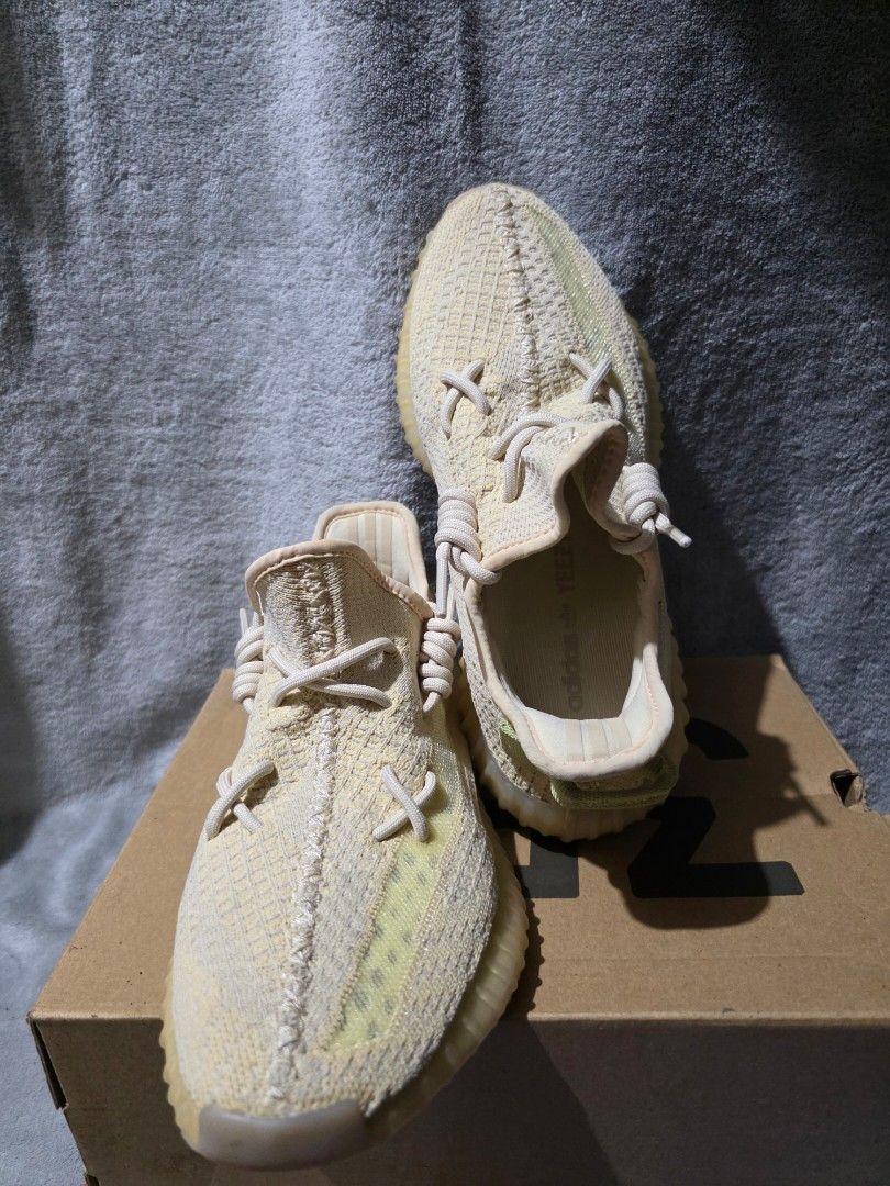 Adidas Yeezy Boost 350 V2 (Category: Sneakers) located in Manila. Submitted by microus (Listing ID 1412104880, Image 1). Description: - Adidas Yeezy Boost 350 V2 sneakers - Color: Cream and light green - Includes original box - Woven upper - Ribbed rubber outsole - White laces - Adidas logo on insole.