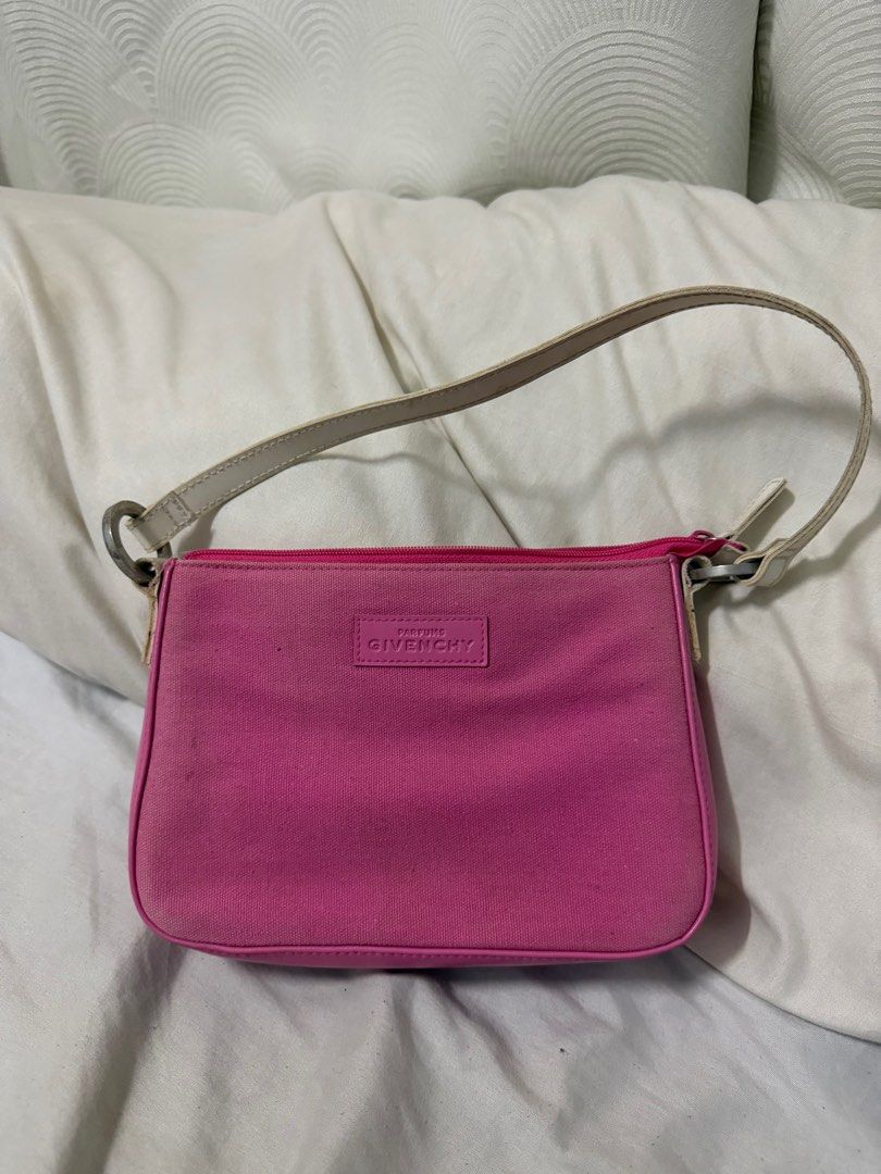 Authentic Givenchy Parfums Bag (Category: Purses & Pouches) located in Cebu City. Submitted by secondhandceb (Listing ID 1411966013, Image 1). Description: Authentic Givenchy Parfums bag slight discoloration / faded no major issues pretty in actual.