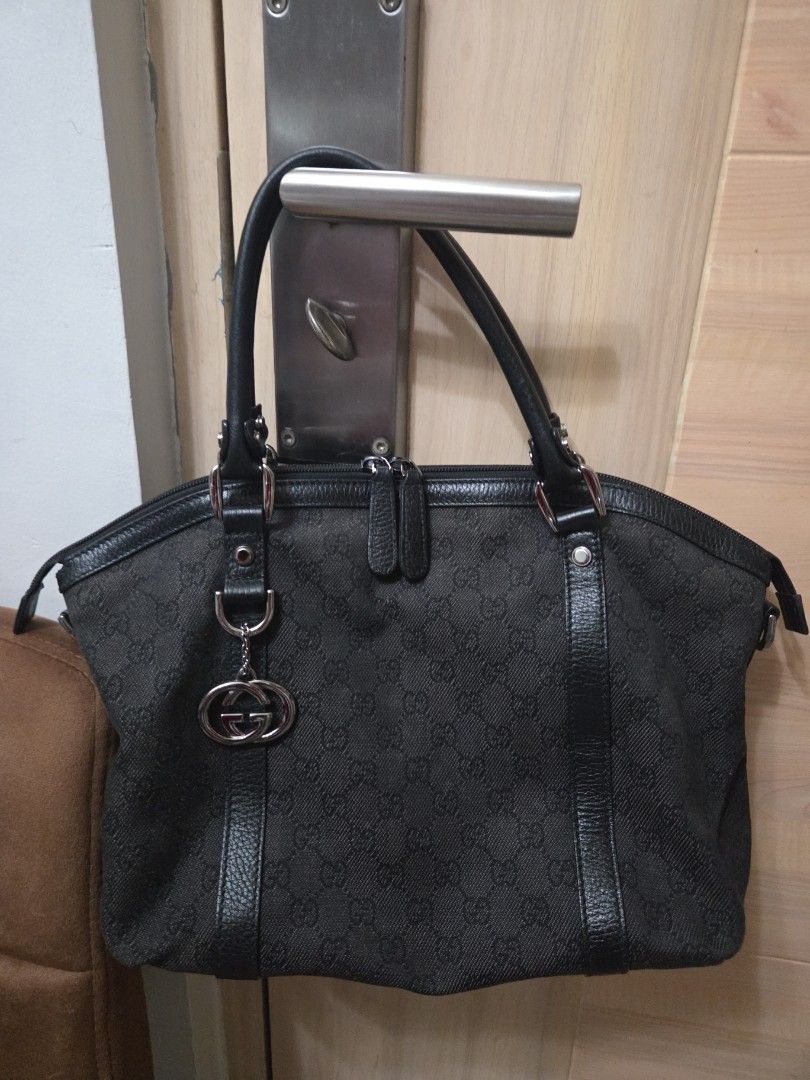 Authentic Gucci GG Canvas Handbag (Category: Luxury Bags & Wallets) located in Manila. Submitted by sterling_grace (Listing ID 1412026326, Image 1). Description: - Authentic Gucci handbag - Iconic GG canvas - Leather accents - Silver-tone hardware - Structured tote design - Medium size, perfect for everyday use - Features front buckle detail with Gucci logo - Distinct Dome Shaped.