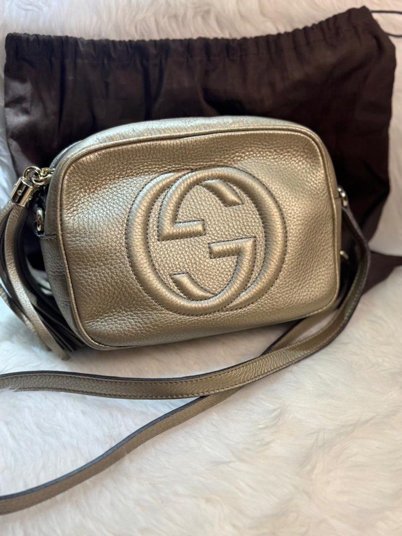 Brand New & Authentic Gucci Soho Disco Bag (Category: Luxury Bags & Wallets) located in Makati City. Submitted by excessthings.ph (Listing ID 1411998216, Image 1). Description: Gucci Brand New Stored for a long time never been used 100% Authentic - Comes with Dustbag only - Guaranteed Authentic - Leather - Metallic finish - Iconic interlocking GG logo - Features a shoulder strap and tassel detail - Includes dust bag - Shape well-maintained.