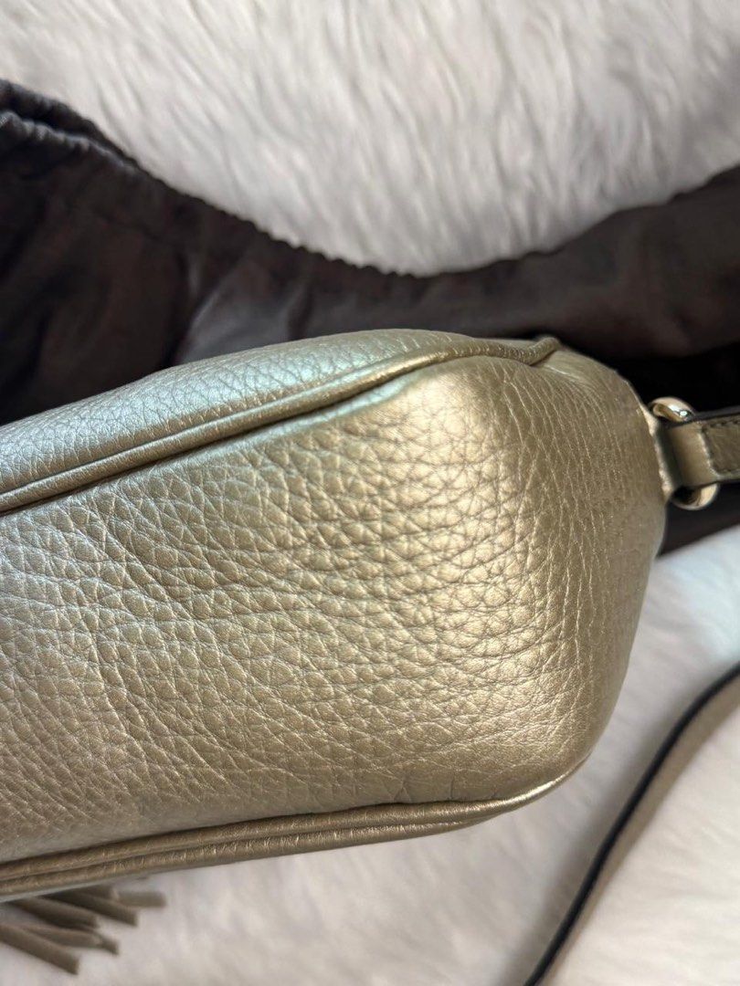 Brand New & Authentic Gucci Soho Disco Bag (Category: Luxury Bags & Wallets) located in Makati City. Submitted by excessthings.ph (Listing ID 1411998216, Image 2). Description: Gucci Brand New Stored for a long time never been used 100% Authentic - Comes with Dustbag only - Guaranteed Authentic - Leather - Metallic finish - Iconic interlocking GG logo - Features a shoulder strap and tassel detail - Includes dust bag - Shape well-maintained.