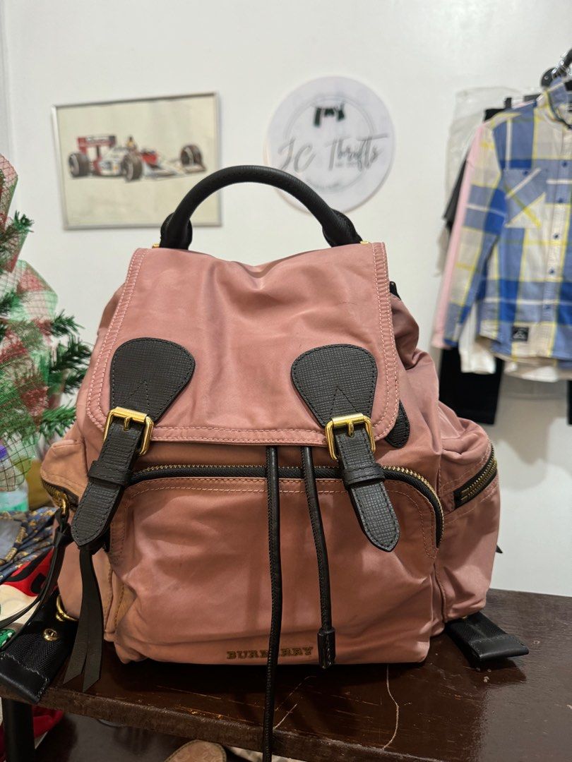 BURBERRY Pink/Black Technical Nylon And Leather Medium Rucksack Backpack Bag (Category: Luxury Bags & Wallets) located in Echague. Submitted by jenniferbo94771 (Listing ID 1412037376, Image 1). Description: BURBERRY Pink/Black Technical Nylon And Leather Medium Rucksack Backpack Bag Good condition 3200.