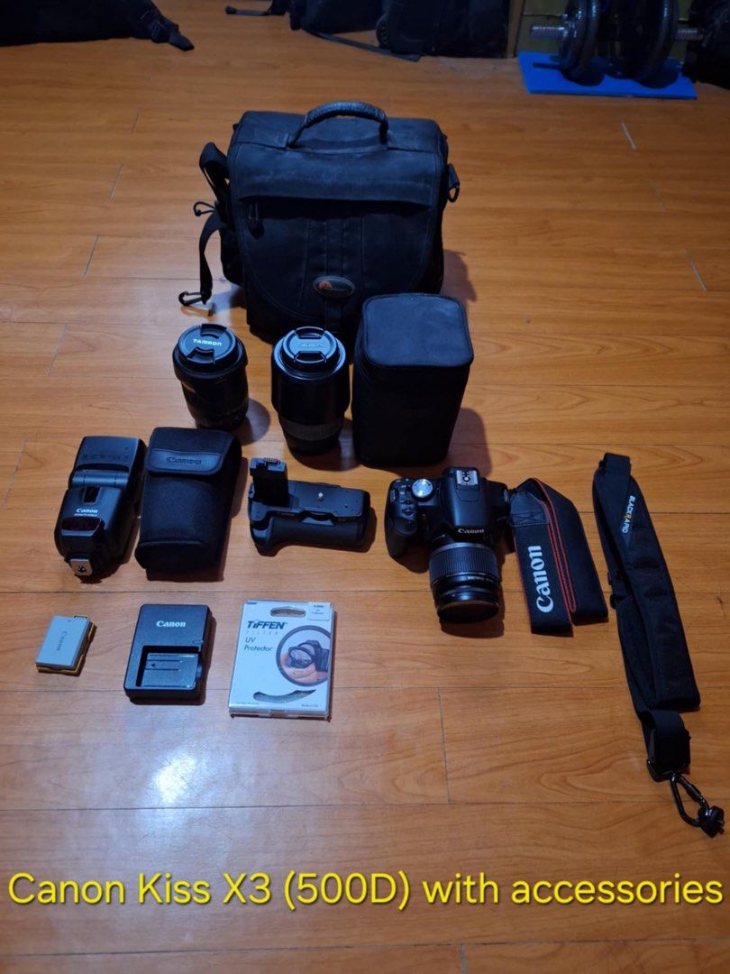 Canon Kiss X3 (EOS 500D) with Accessories (Category: Cameras) located in Cainta. Submitted by alingjess (Listing ID 1412016372, Image 3). Description: Canon Kiss X3 (EOS 500D) with Accessories Includes: - Camera - Battery and charger - Canon speedlite 430 EX II Flash - Canon battery grip BG-E5 - Tamaron Lens 18-270mm - Sigma Lens 70-30mm - Tiffen UV protection filter - Canon and Black Rapid shoulder straps - Camera bag - 4GB memory card.