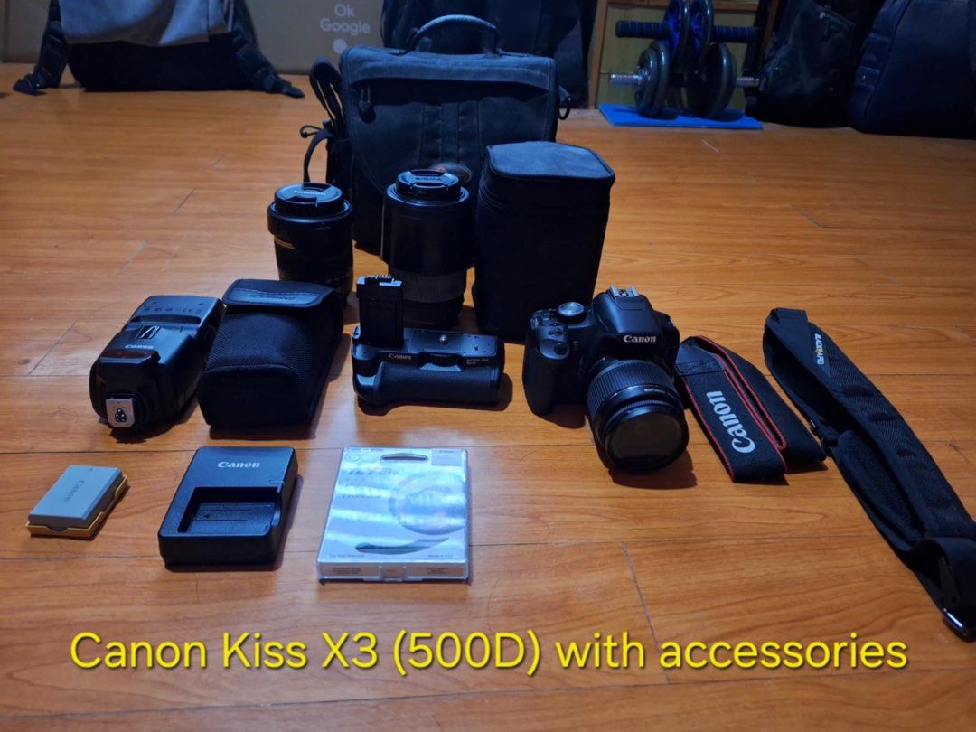 Canon Kiss X3 (EOS 500D) with Accessories (Category: Cameras) located in Cainta. Submitted by alingjess (Listing ID 1412016372, Image 2). Description: Canon Kiss X3 (EOS 500D) with Accessories Includes: - Camera - Battery and charger - Canon speedlite 430 EX II Flash - Canon battery grip BG-E5 - Tamaron Lens 18-270mm - Sigma Lens 70-30mm - Tiffen UV protection filter - Canon and Black Rapid shoulder straps - Camera bag - 4GB memory card.