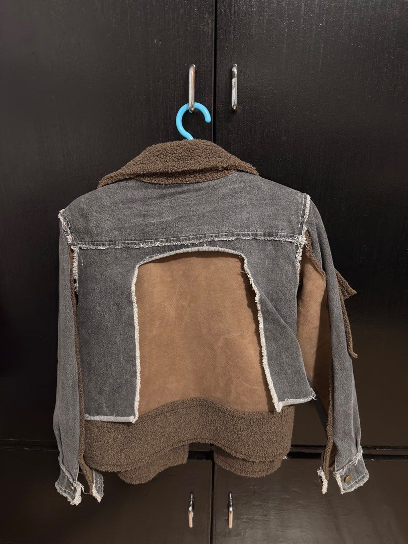 Denim Jacket with Shearling Collar (Category: Coats, Jackets and Outerwear) located in Paranaque City. Submitted by jayvee7 (Listing ID 1412078141, Image 2). Description: - Denim jacket with shearling collar and lining - Unique design with belt detail - Contrasting brown pocket - Distressed look with frayed edges - Warm and fashionable - Ideal for cooler weather - Size Medium .