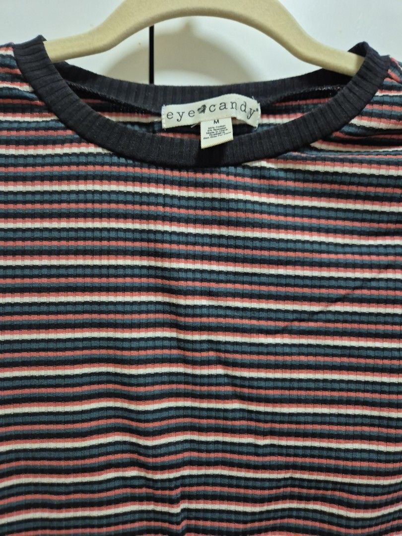 Eyecandy Striped Ribbed Top (Category: Sleeveless) located in Antipolo. Submitted by declutteringkingking (Listing ID 1412029817, Image 2). Description: - Striped pattern - Ribbed texture - Round neckline with black trim - Short sleeves - Wavy hemline - Casual style - Suitable for everyday wear.