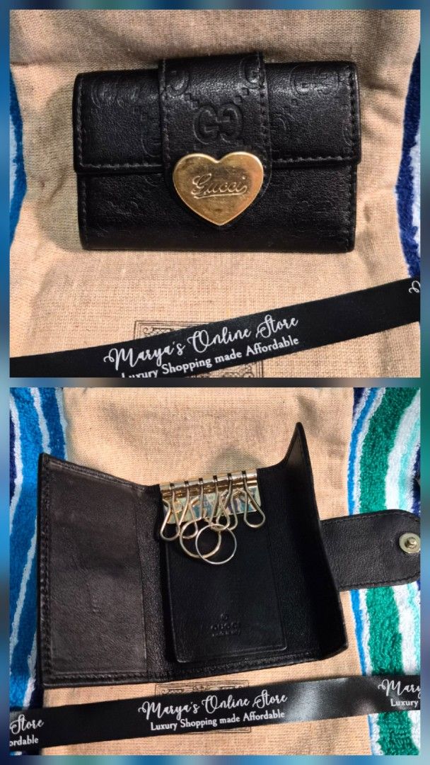 Gucci Heart Key Holder (Category: Luxury Bags & Wallets) located in Quezon City. Submitted by marya_s (Listing ID 1412093355, Image 1). Description: - Authentic Gucci key holder - Black leather - Heart-shaped clasp with Gucci logo - Multiple key rings and small pocket inside.