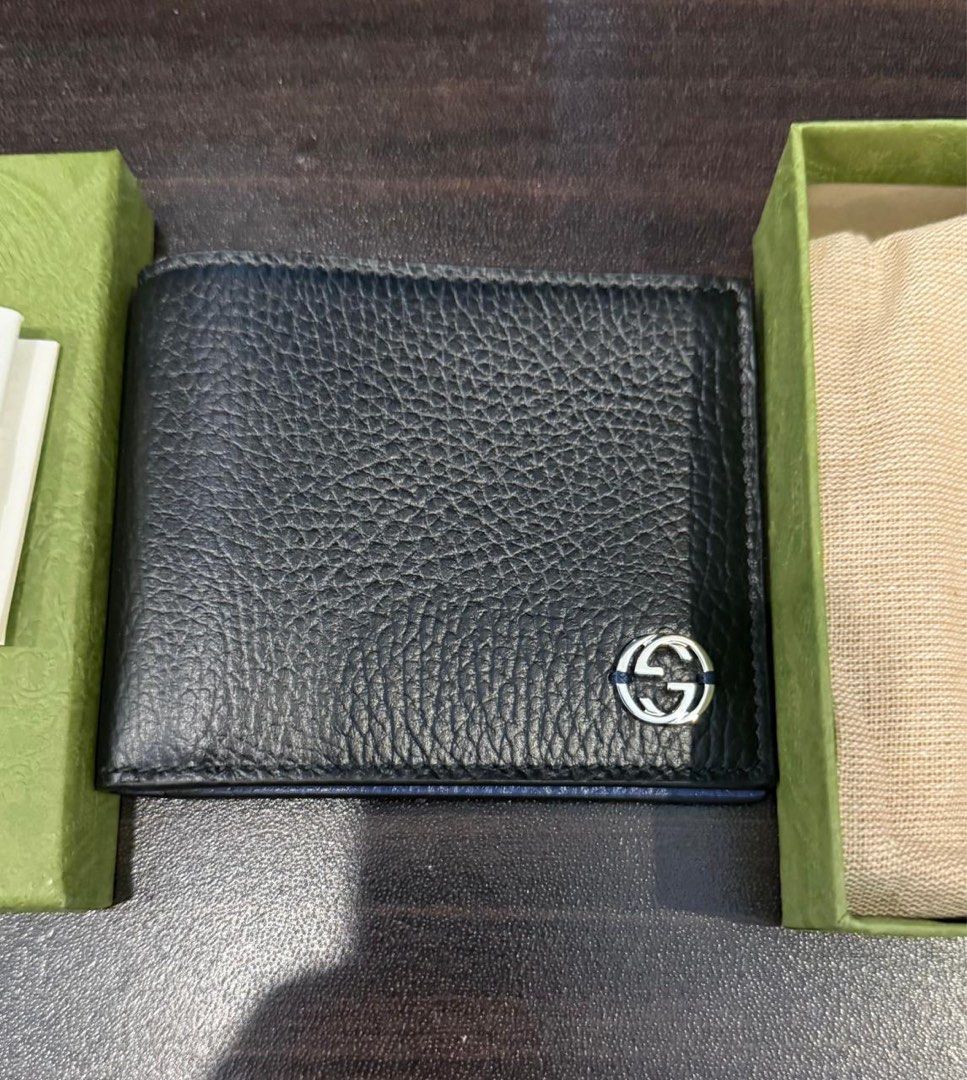 Gucci Black Bifold Short Waller with Blue Interior (Category: Luxury Bags & Wallets) located in Paranaque City. Submitted by ladybug18 (Listing ID 1412053930, Image 3). Description: -gifted Gucci wallet - Black leather exterior with Gucci logo - Includes box, dust bag, and cards - Blue leather interior Pick up : BF Homes paranaque.