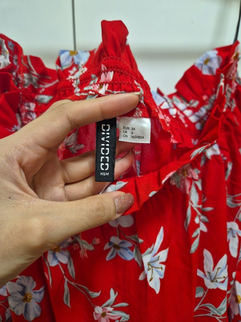 H&M red floral off shoulder blouse (Category: Blouses) located in Antipolo. Submitted by declutteringkingking (Listing ID 1412005456, Image 3). Description: H&m red floral off shoulder top perfect for summer parties or dressy occasions .