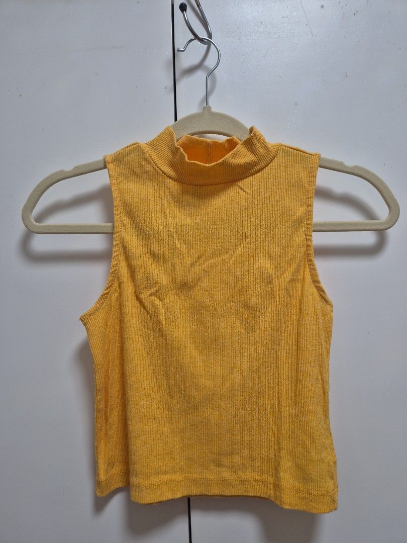 H&M yellow turtleneck sleeveless top (Category: Sleeveless) located in Antipolo. Submitted by declutteringkingking (Listing ID 1411986339, Image 1). Description: fits XS-S.