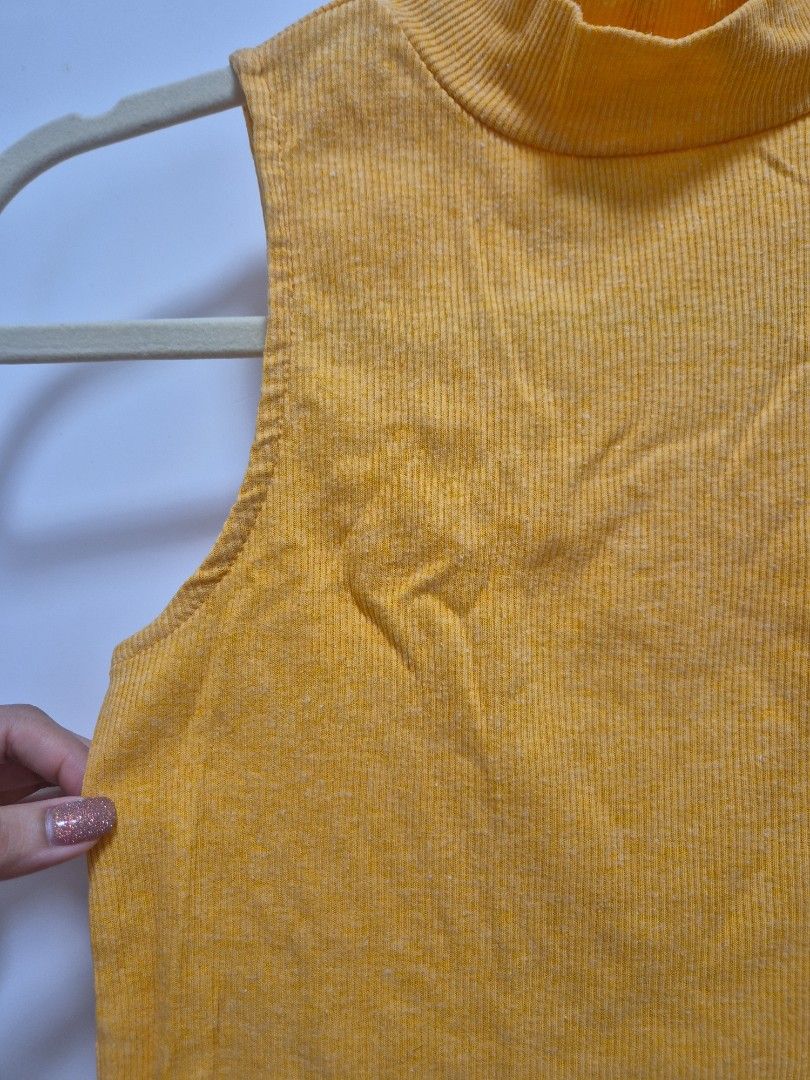 H&M yellow turtleneck sleeveless top (Category: Sleeveless) located in Antipolo. Submitted by declutteringkingking (Listing ID 1411986339, Image 2). Description: fits XS-S.