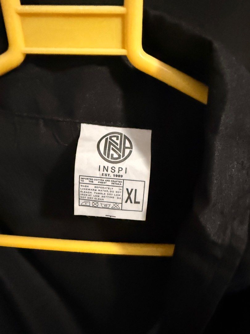 INSPI Black Jacket XL (Category: Coats, Jackets and Outerwear) located in Paranaque City. Submitted by jayvee7 (Listing ID 1412076409, Image 3). Description: - INSPI black jacket - Size: XL - Features: - Full zipper closure - Collared neckline - Long sleeves - Material: Smooth, possibly synthetic fabric - Design: Classic and simple - Ideal for casual wear.