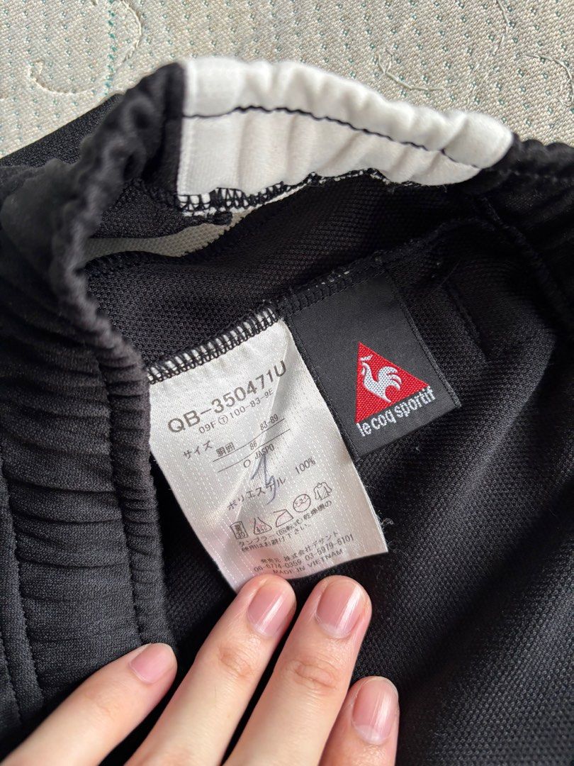 Le Coq Sportif Shorts (Category: Shorts) located in Los Banos. Submitted by declutterlistt (Listing ID 1411958330, Image 3). Description: - Le Coq Sportif black shorts - White side stripe - Long fit / see measurements - Replaced the waistband with generic shoelace - Faded logo - No other issue.