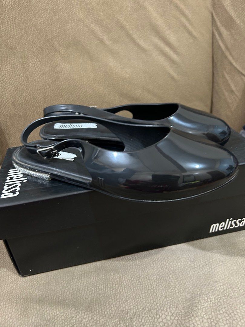 Melissa Lipstick AD Black Glitter Sandals (Category: Flats & Sandals) located in Quezon City. Submitted by thei. (Listing ID 1411985015, Image 3). Description: Slightly used 9/10 Melissa og with box - Black Melissa Lipstick AD sandals - Size: USA 5 - Slingback style with buckle - Color: Black/Glitter.