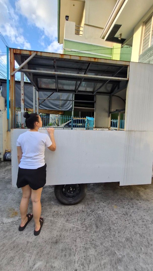Mobile Food Cart (Category: Other Home Furniture) located in Quezon City. Submitted by ddpilar (Listing ID 1412038639, Image 3). Description: Selling a heavy-duty food trailer / mobile cart frame, ideal for food businesses and pop-up concept MEASUREMENTS: • 322.5 cm (L) • 176 cm (W) • 229 cm (H) DETAILS • Heavy-duty steel frame • With steel flooring and roofing • Partial side panels installed • Serving window • Towable and movable • Ready for cus