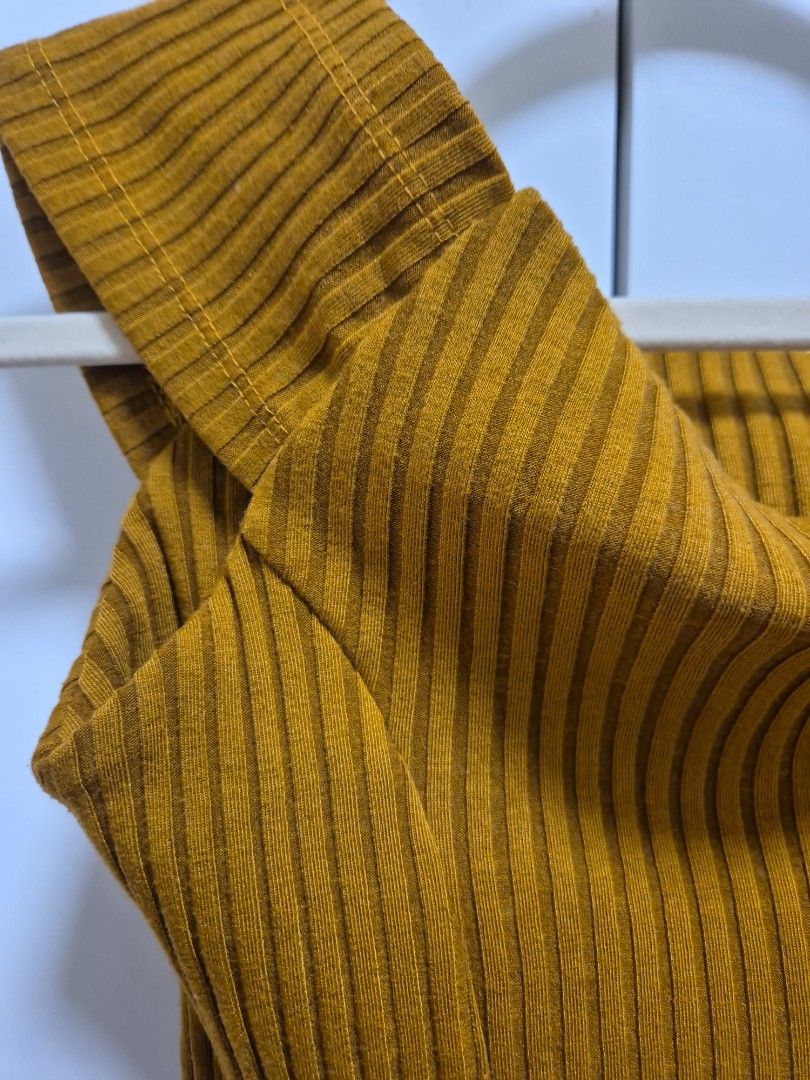 Mustard Yellow Ribbed off shoulder top (Category: Blouses) located in Antipolo. Submitted by declutteringkingking (Listing ID 1412013937, Image 2). Description: - Mustard yellow color - Ribbed design - off shoulder - Knit fabric - Solid color - Versatile style.