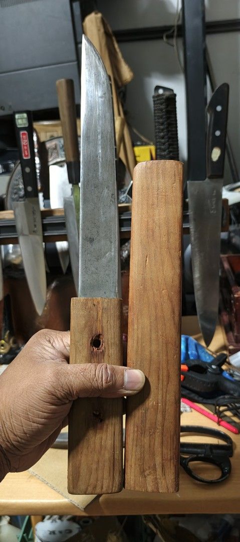 Nicholson No. 25 Knife with Sheath (Category: Knives & Chopping Boards) located in Polomolok. Submitted by dkljapansurplus (Listing ID 1412090596, Image 3). Description: - Vintage Nicholson No. 25 knife - Blade length 236mm - Includes wooden sheath - Blade marked "Nicholson USA No. 25" - Features a wooden handle.