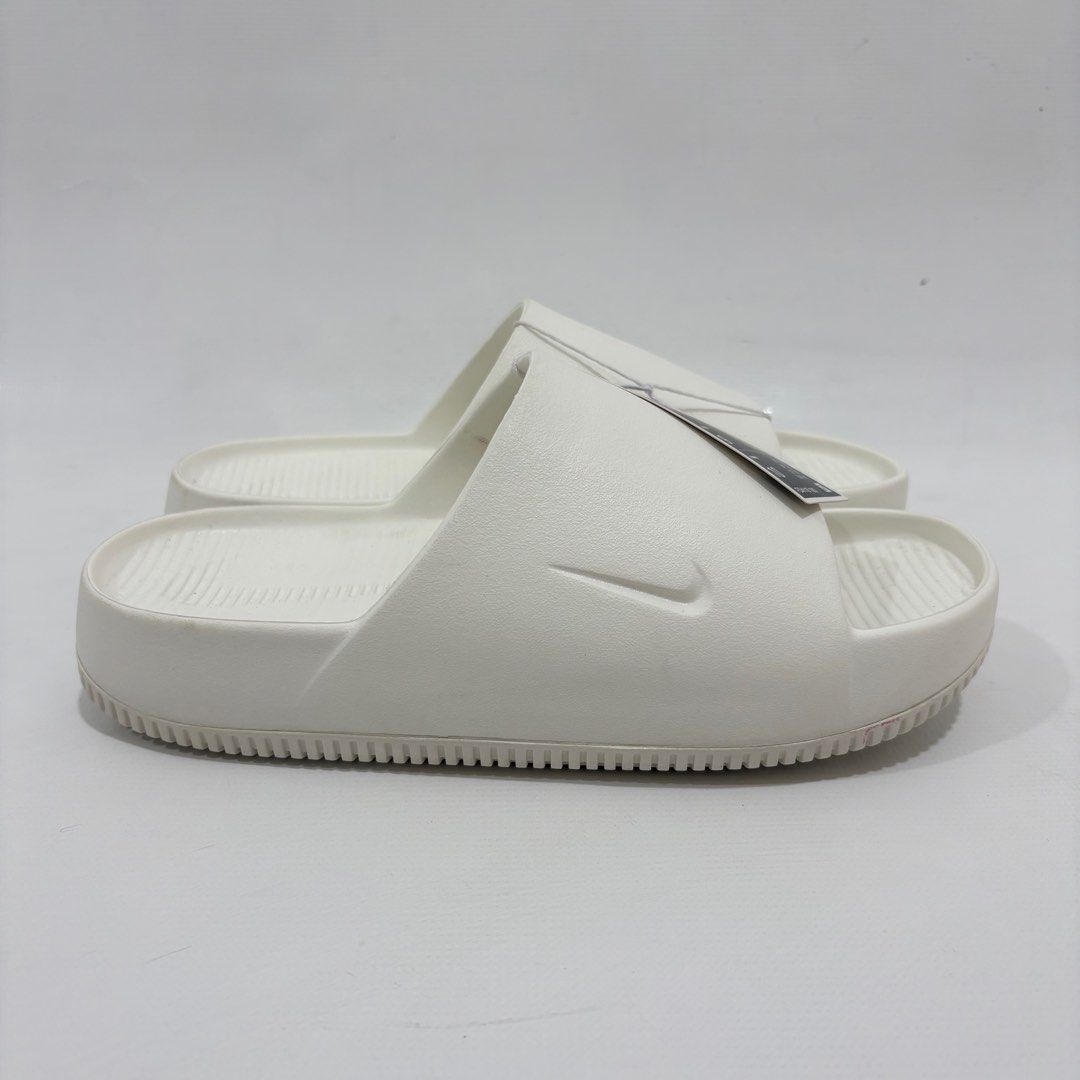 Nike Calm Men's Slide - Sail/Sail (Category: Slippers & Slides) located in Quezon City. Submitted by cobbie03 (Listing ID 1411991836, Image 3). Description: - Nike Calm Slides - Color: SAIL - Available Sizes: 9 and 10 - New with tags - Textured sole for grip - Perfect for casual wear.