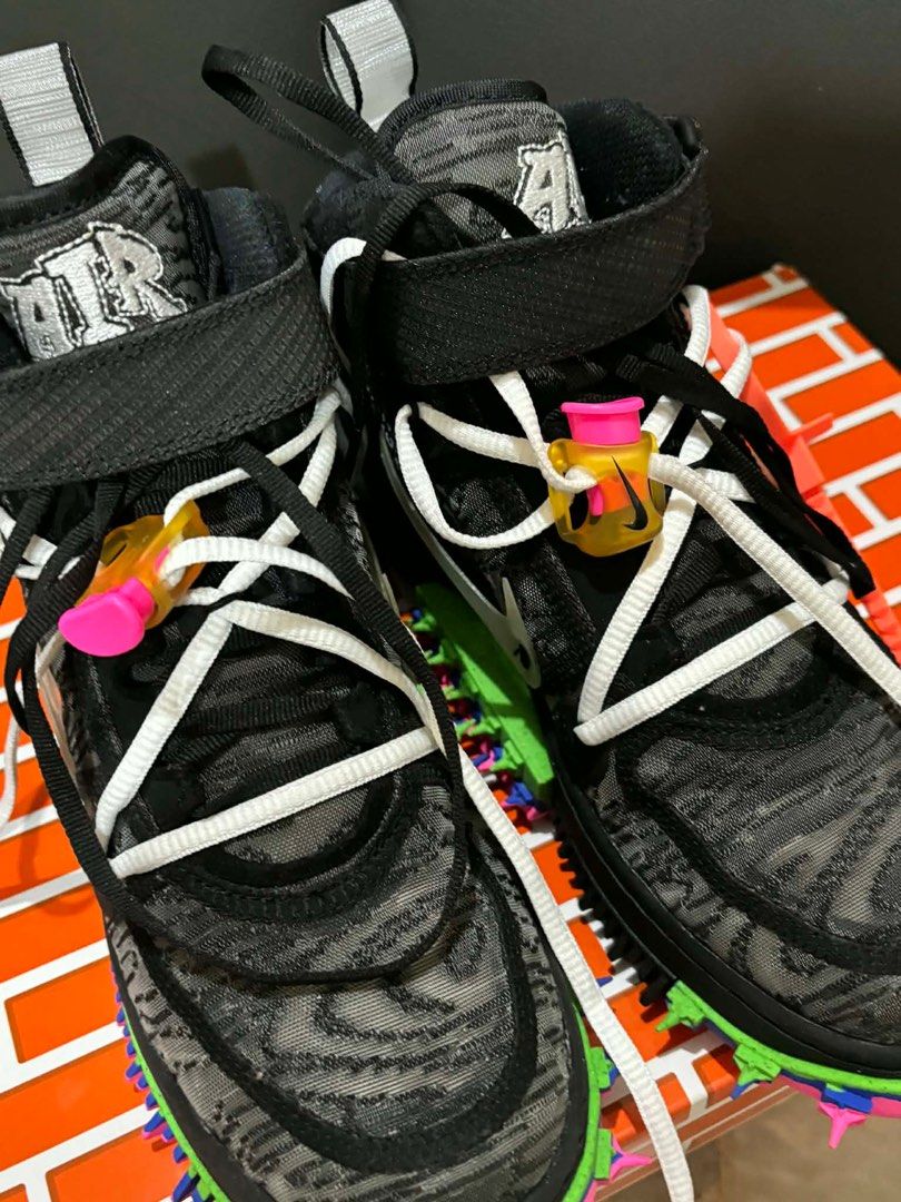Nike Off-White Air Force 1 Mid (Category: Sneakers) located in Quezon City. Submitted by bella_ciao (Listing ID 1411993112, Image 1). Description: - Off-White x Nike Air Force 1 Mid - Black and grey patterned upper - White laces - Black strap - Signature Off-White zip tie - Multi-colored sole - Includes original box Size: men’s 5.5 Women’s 7 24cm.