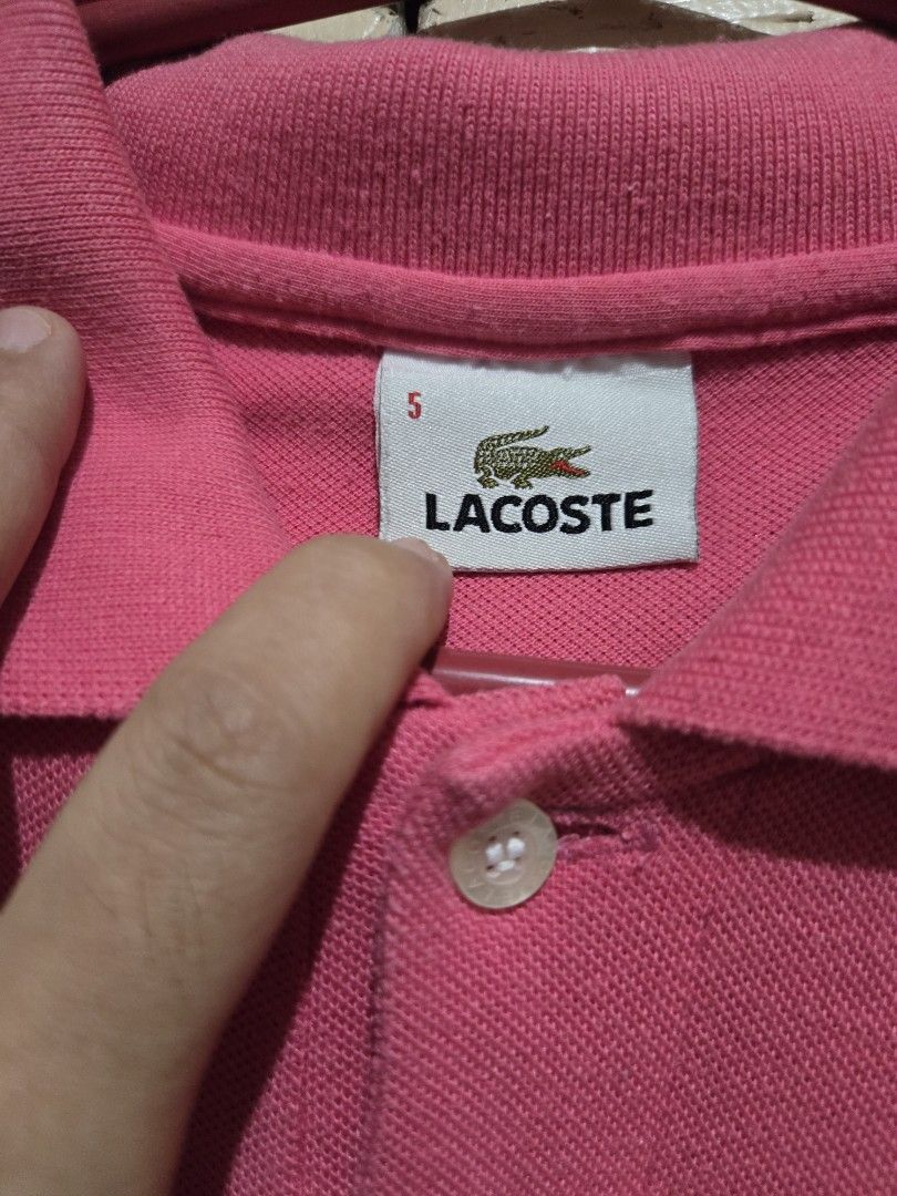 Preloved Lacoste polo shirt (Category: Shirts) located in Cainta. Submitted by nessft (Listing ID 1411986948, Image 2). Description: Original Preloved. see pix to appreciate black 1500 orange 1500 pink 1200.