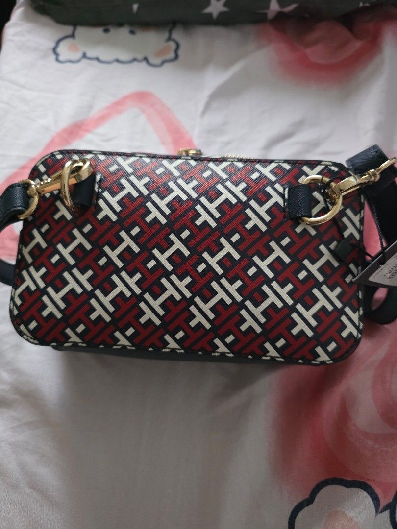 Tommy Hilfiger Crossbody Bag (Category: Cross-body Bags) located in Mandaluyong City. Submitted by summerinjun (Listing ID 1412096268, Image 2). Description: - Tommy Hilfiger crossbody bag - New with tag - Features a stylish red, white, and navy blue pattern - Detachable strap - Gold-tone hardware - Perfect for everyday use or special events.