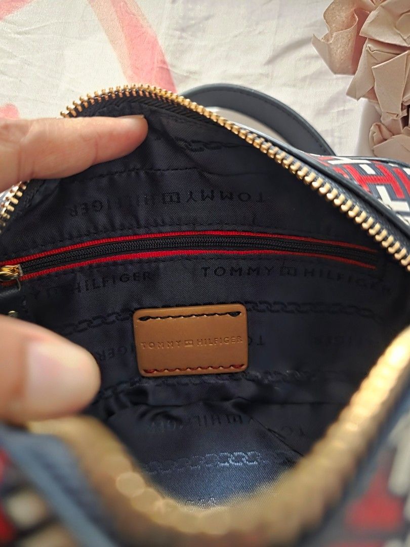 Tommy Hilfiger Crossbody Bag (Category: Cross-body Bags) located in Mandaluyong City. Submitted by summerinjun (Listing ID 1412096268, Image 3). Description: - Tommy Hilfiger crossbody bag - New with tag - Features a stylish red, white, and navy blue pattern - Detachable strap - Gold-tone hardware - Perfect for everyday use or special events.