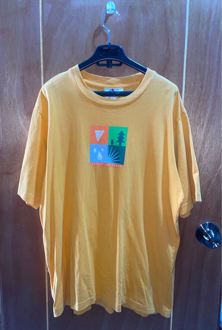 Vintage Adidas Tee (Category: Tshirts & Polo Shirts ) located in Pasig City. Submitted by dzeims (Listing ID 1412049375, Image 1). Description: - Excellent Condition - Color Rate: 9/10 - Light Orange (may vary due to lighting) - Size: Large on Tag - Dimes: W23 x L29 - Complete Tags - Issue: Tiny dot stain, minor crack prints 🏷️ 300 + Sf 📍 Pasig City .