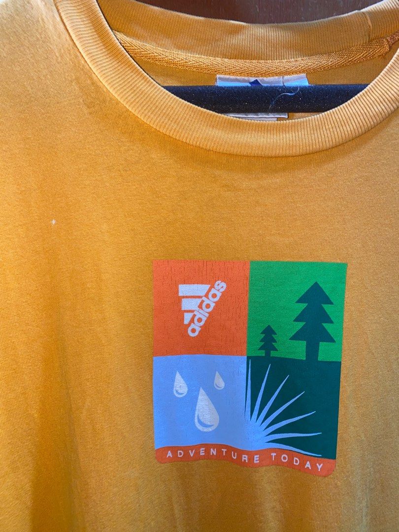 Vintage Adidas Tee (Category: Tshirts & Polo Shirts ) located in Pasig City. Submitted by dzeims (Listing ID 1412049375, Image 2). Description: - Excellent Condition - Color Rate: 9/10 - Light Orange (may vary due to lighting) - Size: Large on Tag - Dimes: W23 x L29 - Complete Tags - Issue: Tiny dot stain, minor crack prints 🏷️ 300 + Sf 📍 Pasig City .