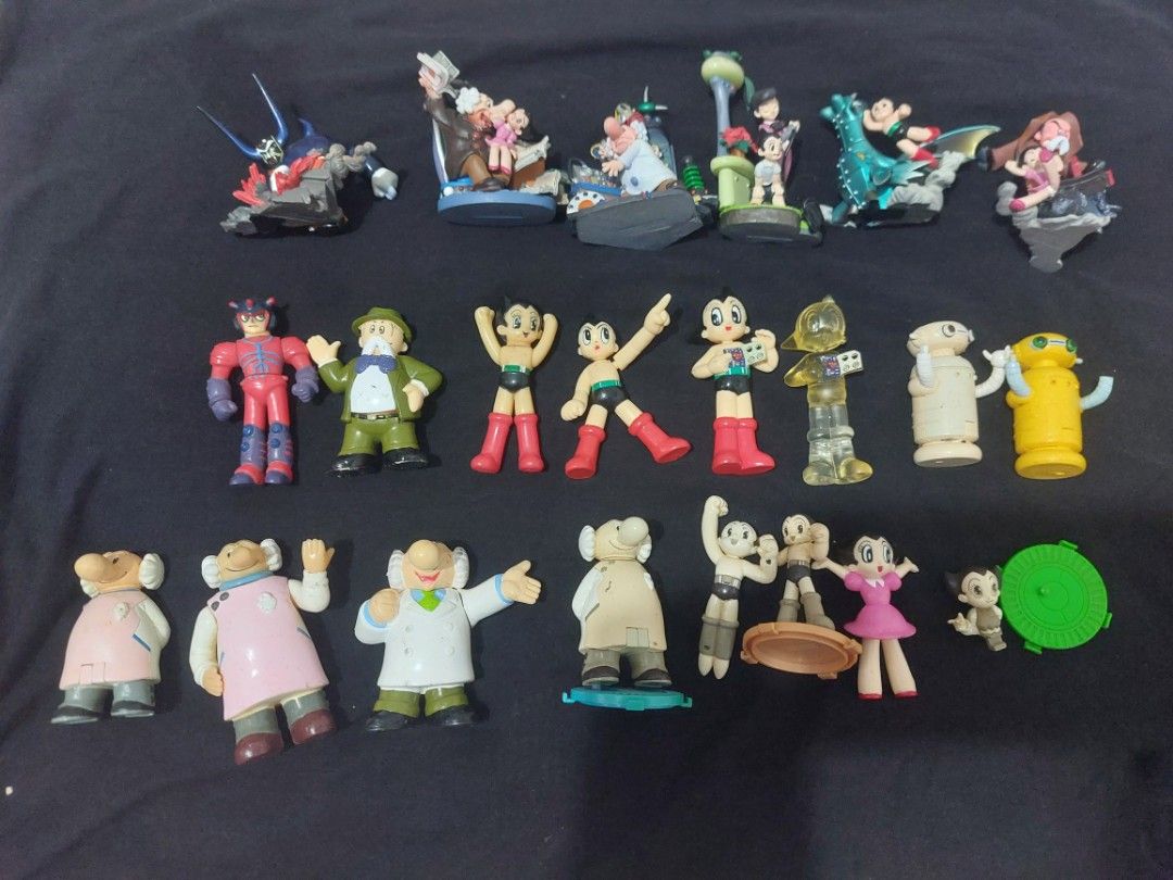 Vintage astroboy Toy Figures Collection (Category: Figurines & Statues) located in Lubao. Submitted by 23dang (Listing ID 1412003579, Image 2). Description: - Vintage toy figure collection - Includes Astro Boy and other cartoon characters - Figures in various sizes and poses - Some figures are mounted on bases - Features a unique figure with a ray gun - Some figures are in a lying down position.