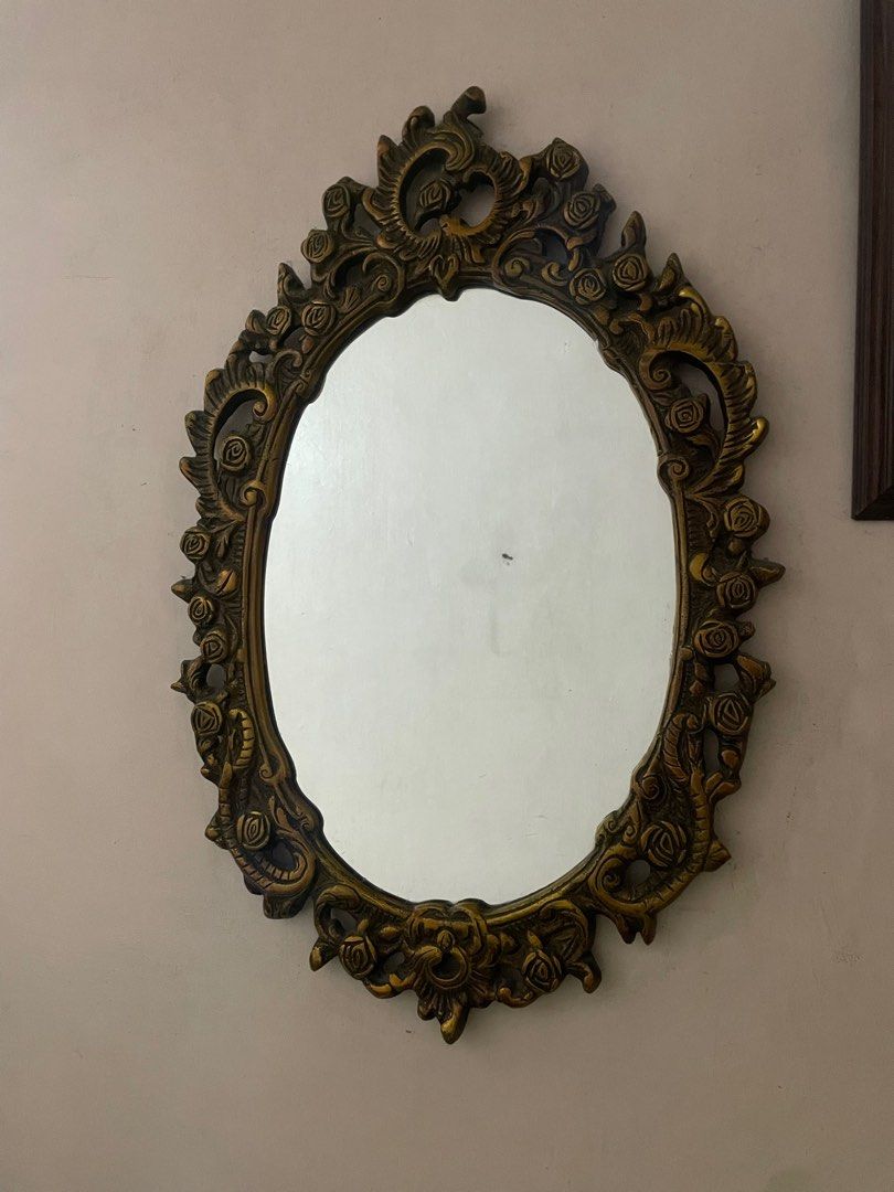 Vintage Oval Mirror with Ornate Frame (Category: Mirrors) located in Quezon City. Submitted by rein.24 (Listing ID 1411960684, Image 1). Description: - Size: 24 x 16” - Oval mirror with antique-style frame - Intricate floral and scroll detailing on the frame - Perfect for bedroom, living room, or entryway - Adds a touch of vintage charm.